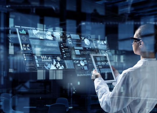 Attractive woman scientist with tablet in hands . Mixed media