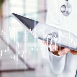 Man doctor using tablet computer in hospital