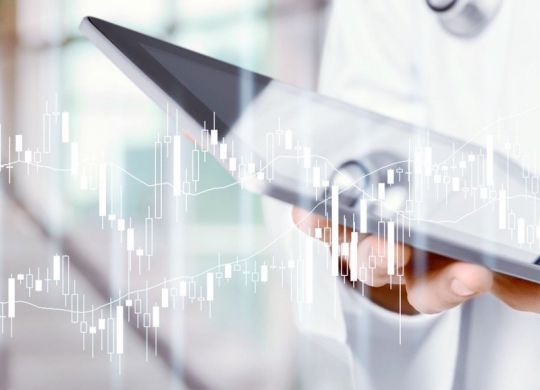 Man doctor using tablet computer in hospital
